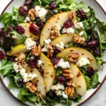 Pear walnut salad with cranberries and goat cheese