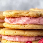 Lemon Sandwich Cookies with Strawberry Frosting